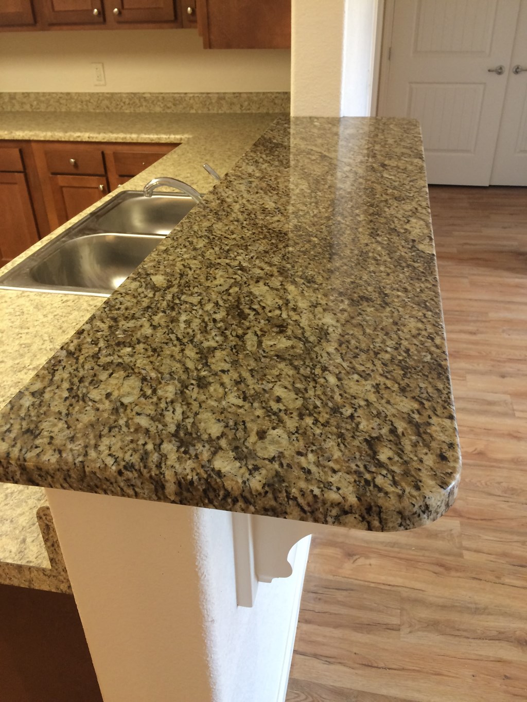 a closeup of a granite counter top in a kitchen