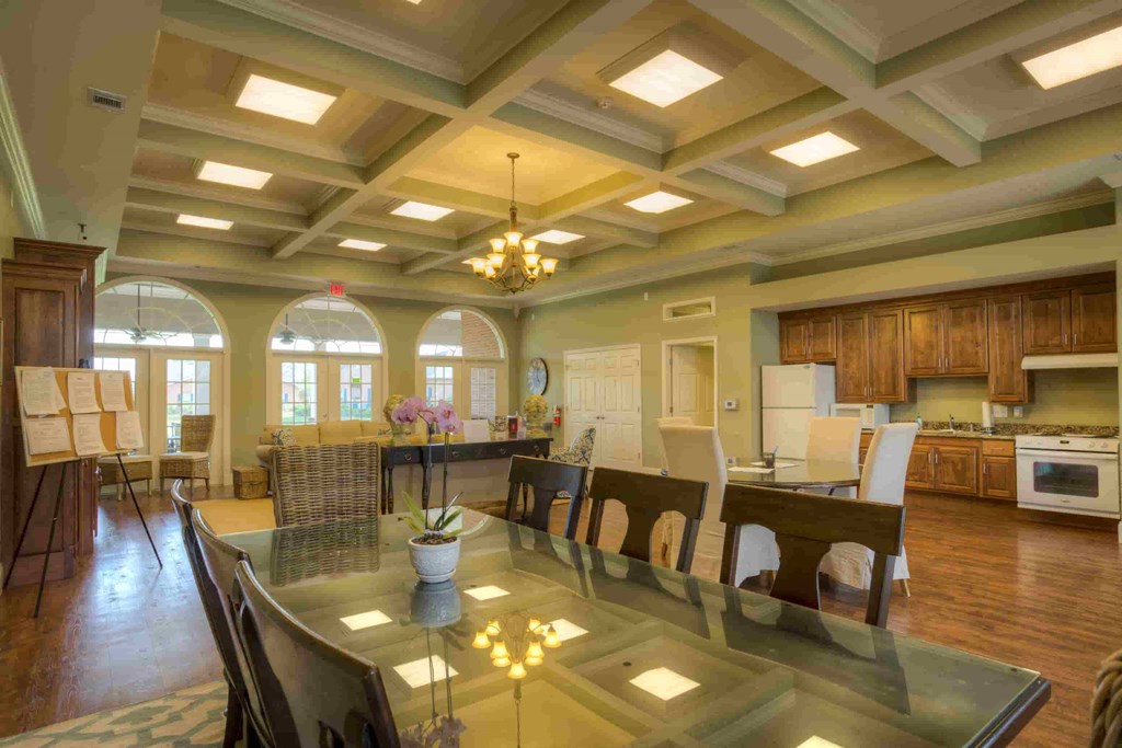 a kitchen and dining room with a glass table and chairs
