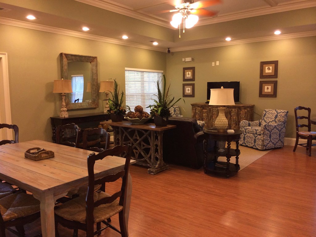 a dining room and living room with a table and chairs