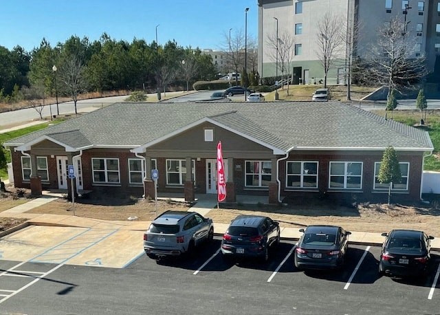 a parking lot with cars in front of a house