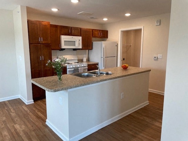 a kitchen with a counter top and a refrigerator