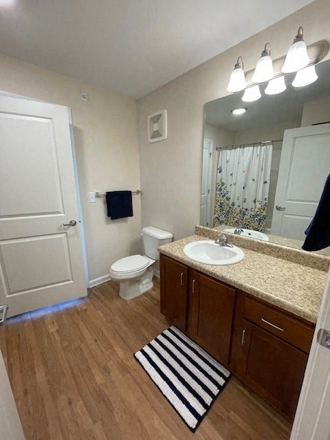 a bathroom with a sink toilet and a mirror