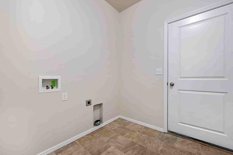 a room with a white door and a wall with a door way