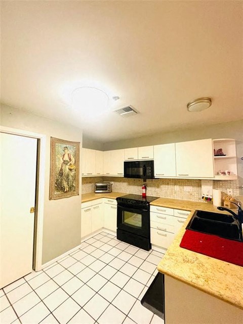 a kitchen with a stove and a counter top