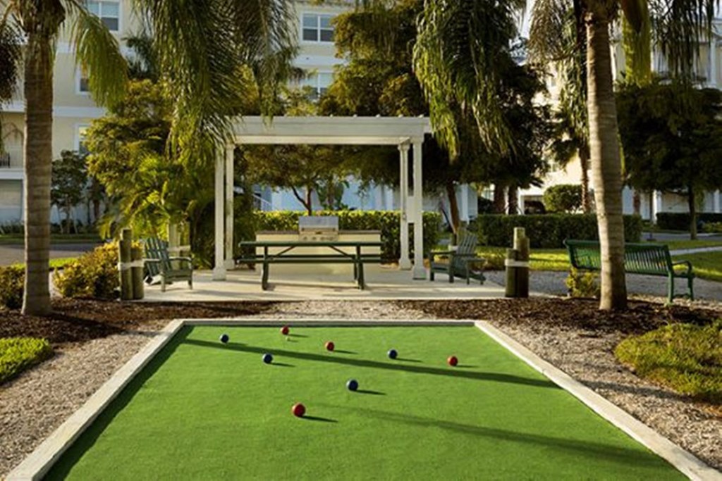 a game of bocce ball in a park
