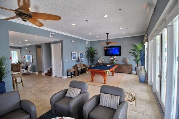 a large living room with a pool table