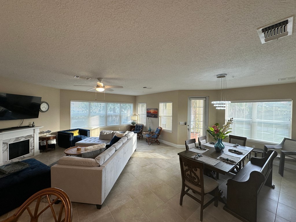 a living room and dining room with a couch and a table