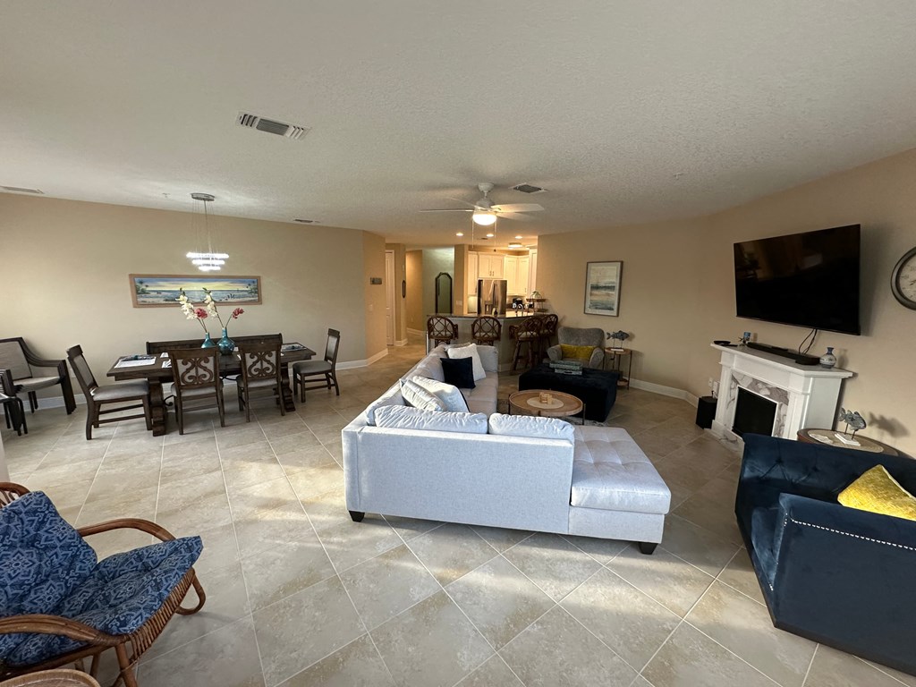 the living room is open to the dining room and kitchen