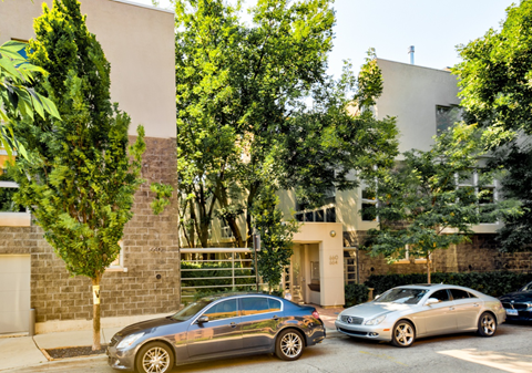 two cars parked in front of a building