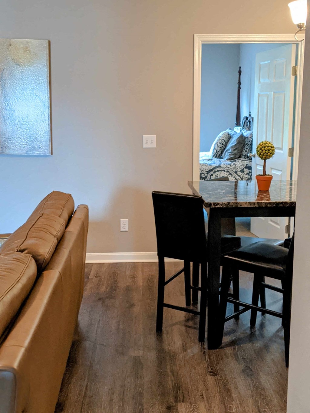 a living room and dining room with a couch and a table