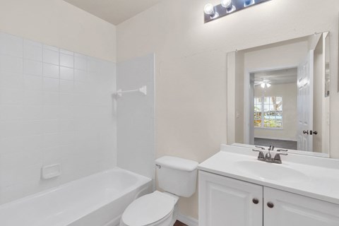 a bathroom with a sink toilet and a tub