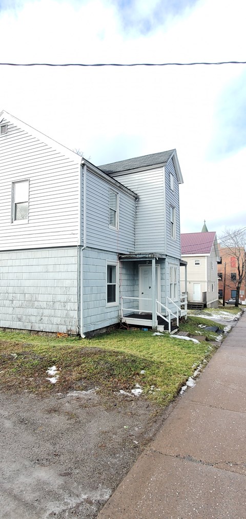 a house that has been torn down on a street