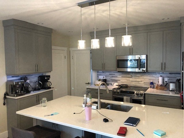 a kitchen with a counter top and a sink