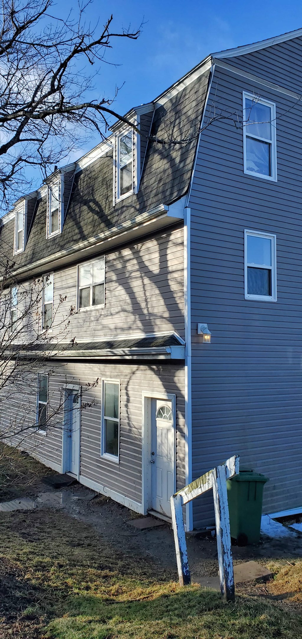 a house with a tape measure in front of it