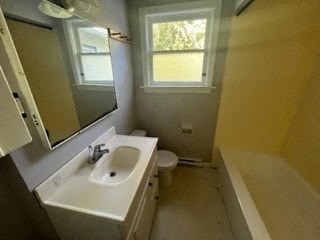 a bathroom with a sink and a toilet and a mirror