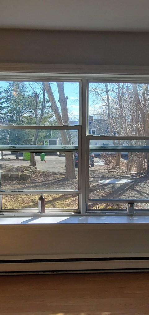 A view of a playground through a window.