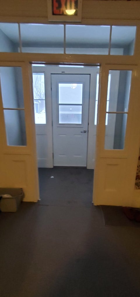 a view of the entrance to a room with doors