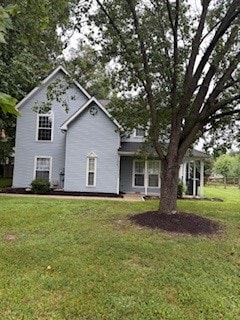 A house with a tree in front of it.