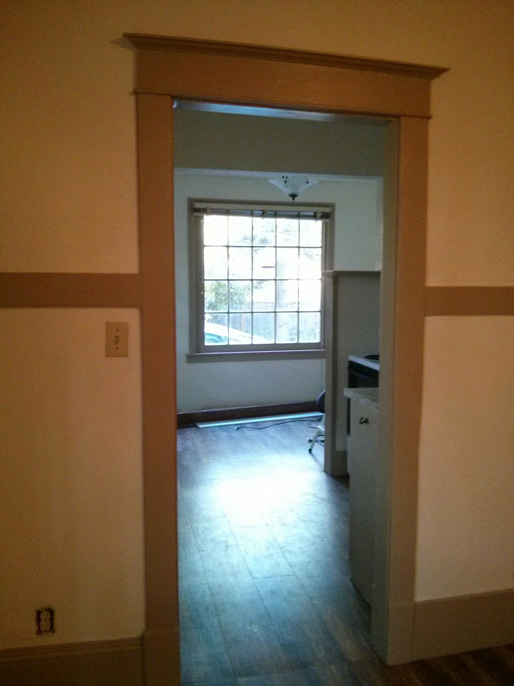 the living room looking into the dining room from the kitchen