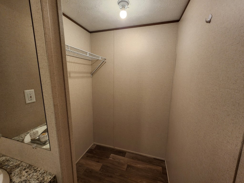 a small bathroom with a mirror and a shower