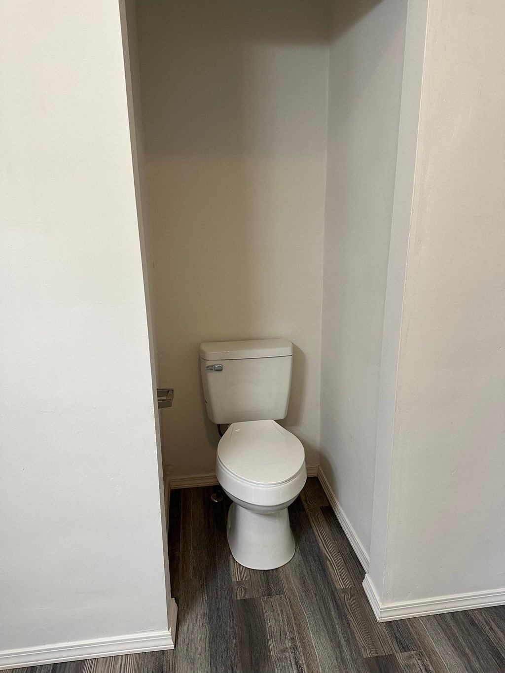 a small bathroom with a toilet in the corner