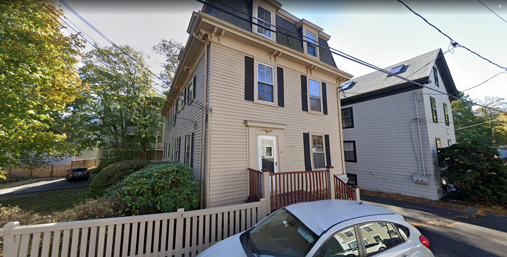 a house with a car parked in front of it