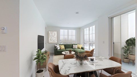 a living room with a couch and a table and chairs