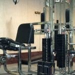 a chair sitting in front of a machine in a room