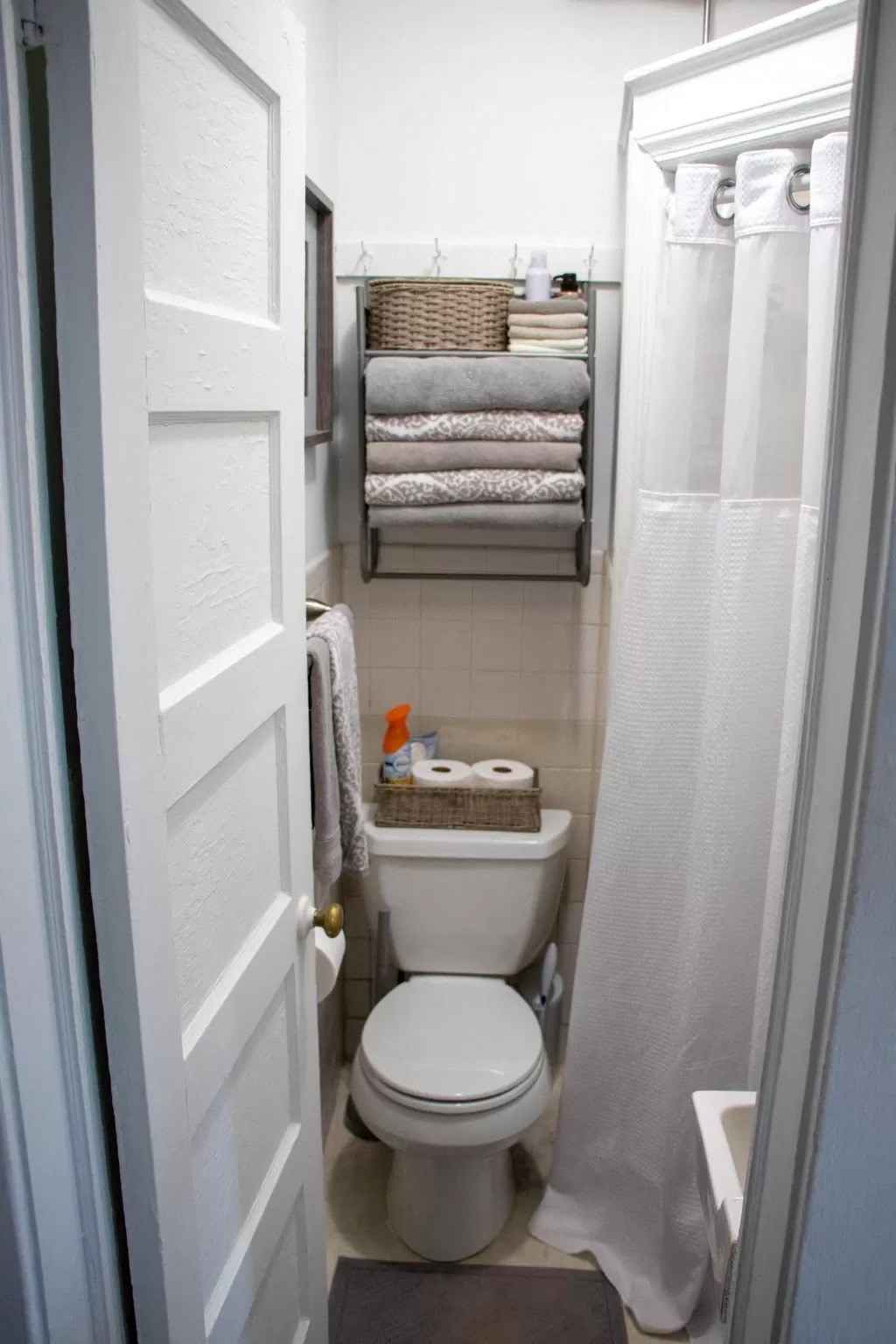 a small bathroom with a toilet and a shower