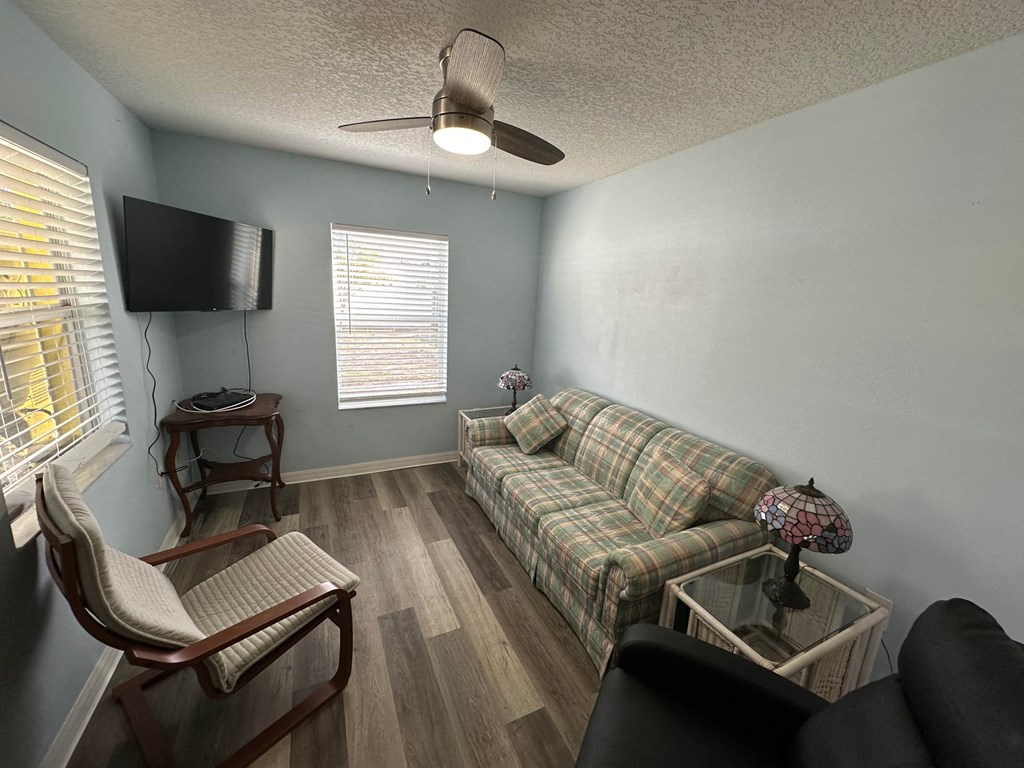 a living room with a couch and a tv