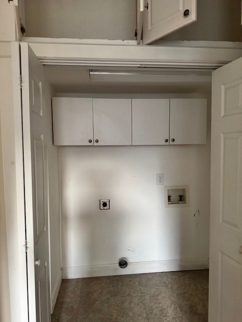 A white kitchen with a cabinet and a door.
