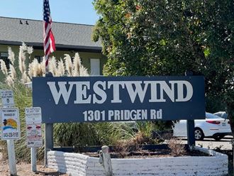 a sign that says westwind 1800 in front of a building