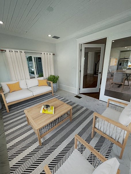 a living room with a couch and a table