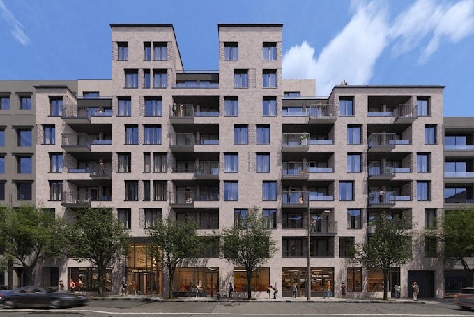 an apartment building on a city street with cars