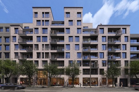 an apartment building on a city street with cars