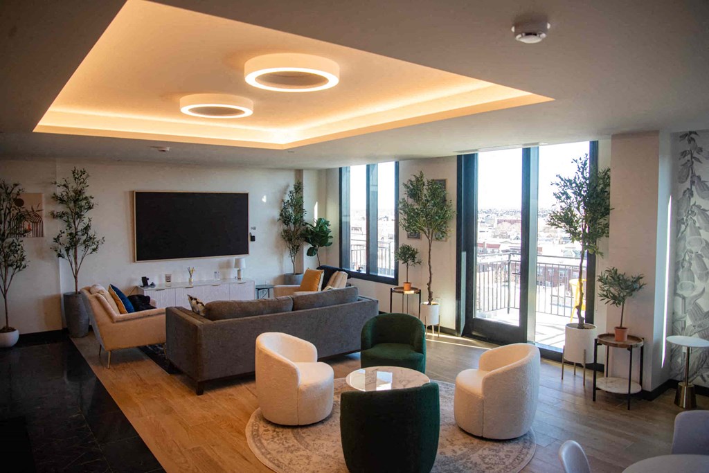 a living room with couches and chairs