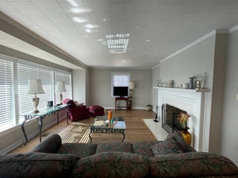 a living room with a couch and a fireplace