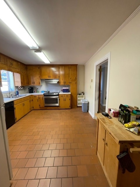 A kitchen with wooden cabinets and tile flooring.