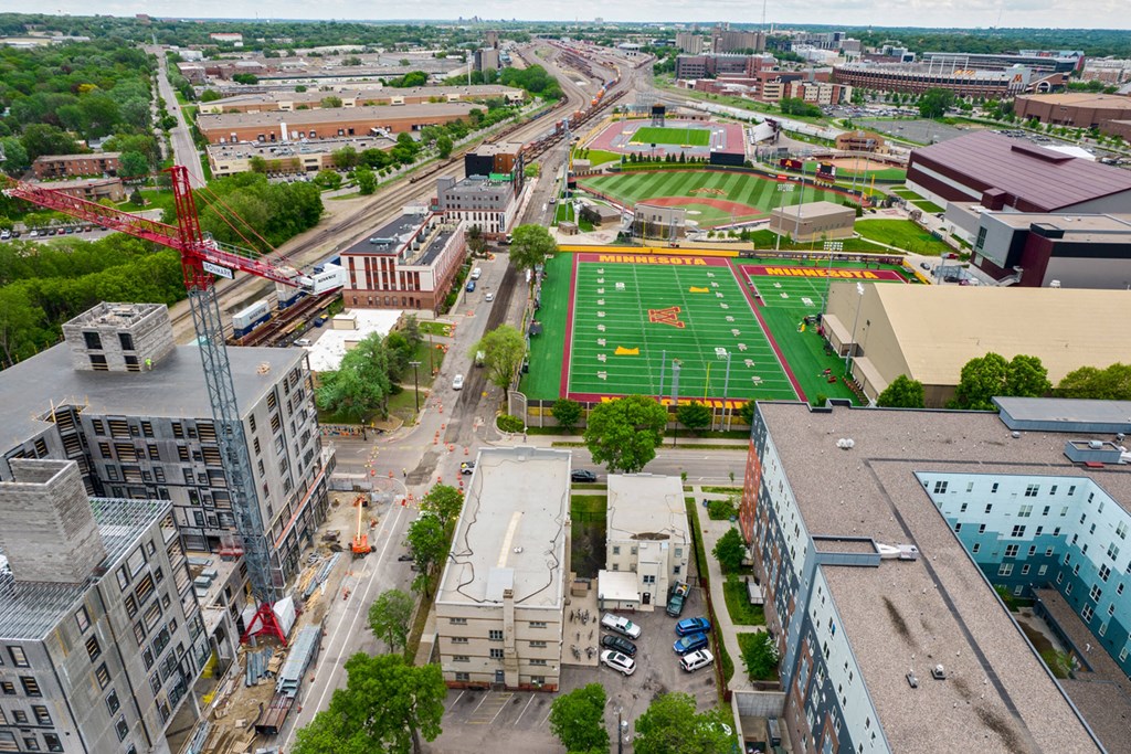 an aerial view of a city with a football field