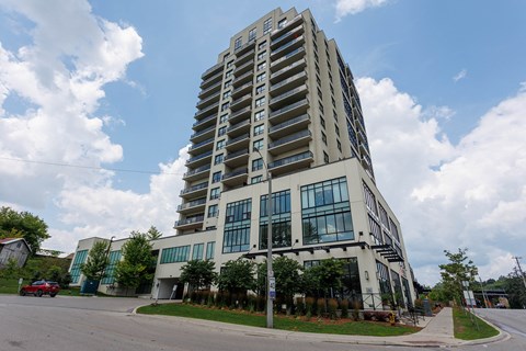 an apartment building on the corner of a street