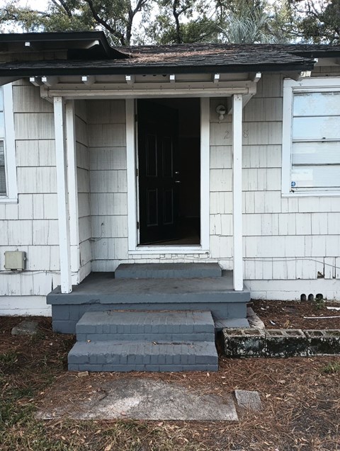 the front porch of the house is ready for us to come in