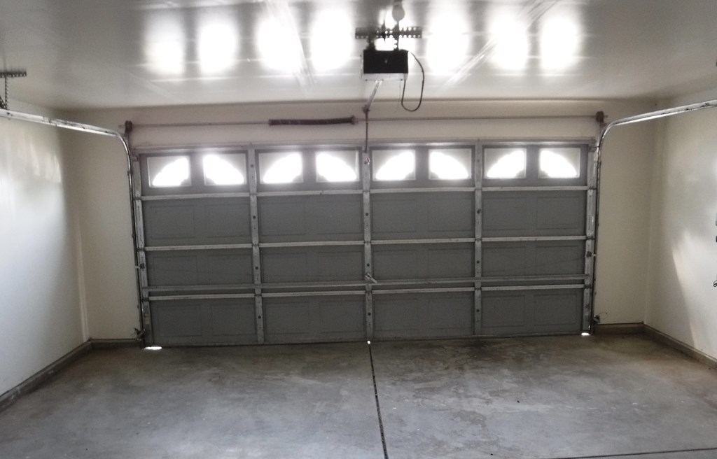 the garage door is closed and the lights are on in a garage