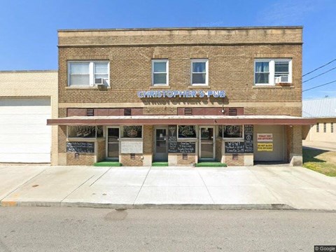 a brick building with a sign on the front of it