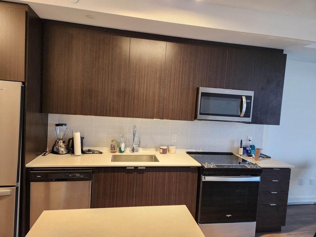 a kitchen with a sink and a microwave