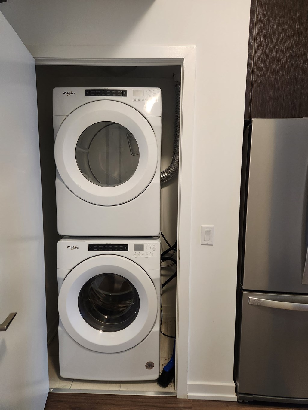 a washing machine and dryer in a small closet