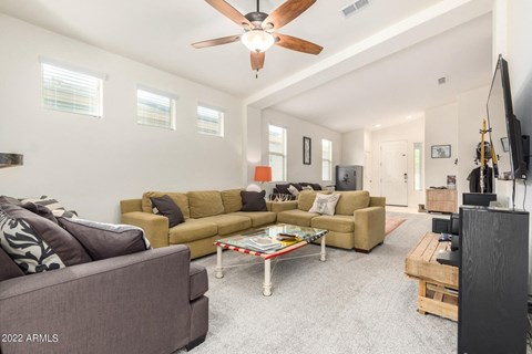 a living room with couches and a coffee table