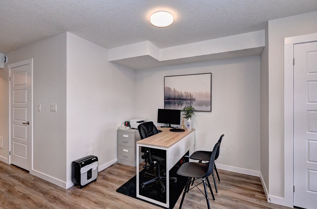 a home office with a desk and a computer