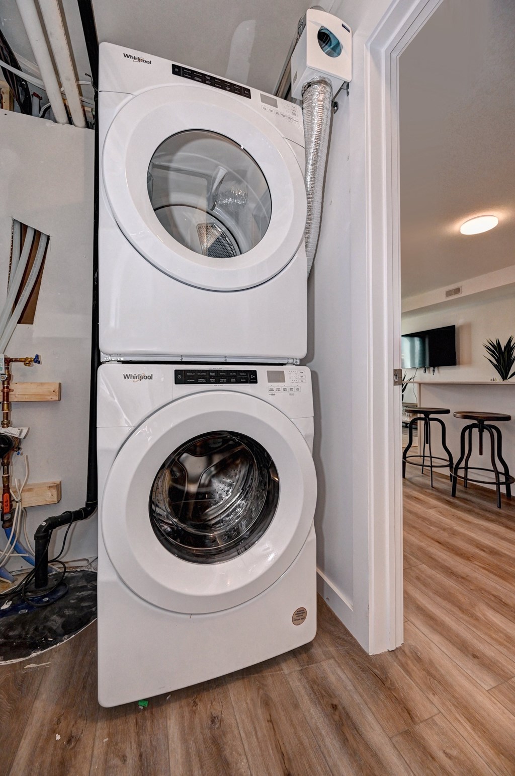 a front loading washer and dryer in a laundry room