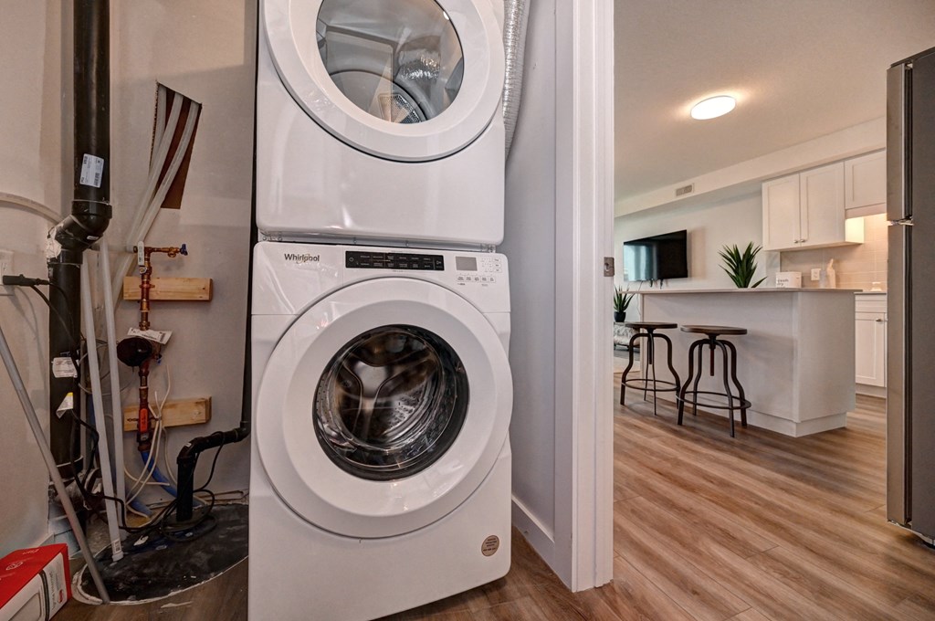 a front loading washer and dryer in a home with a kitchen