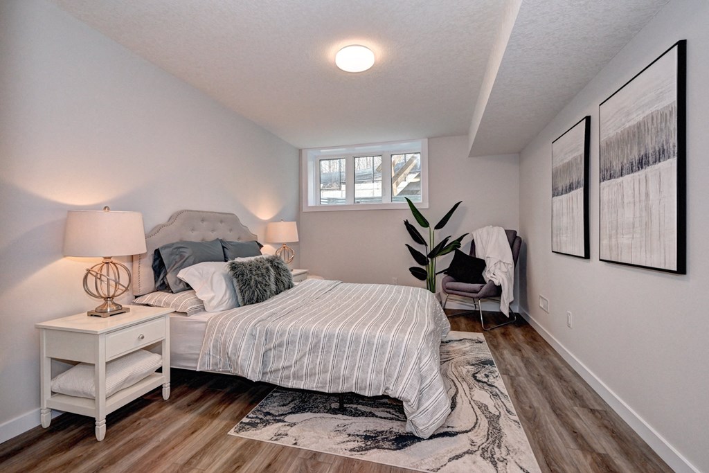 an attic bedroom with a bed and a window
